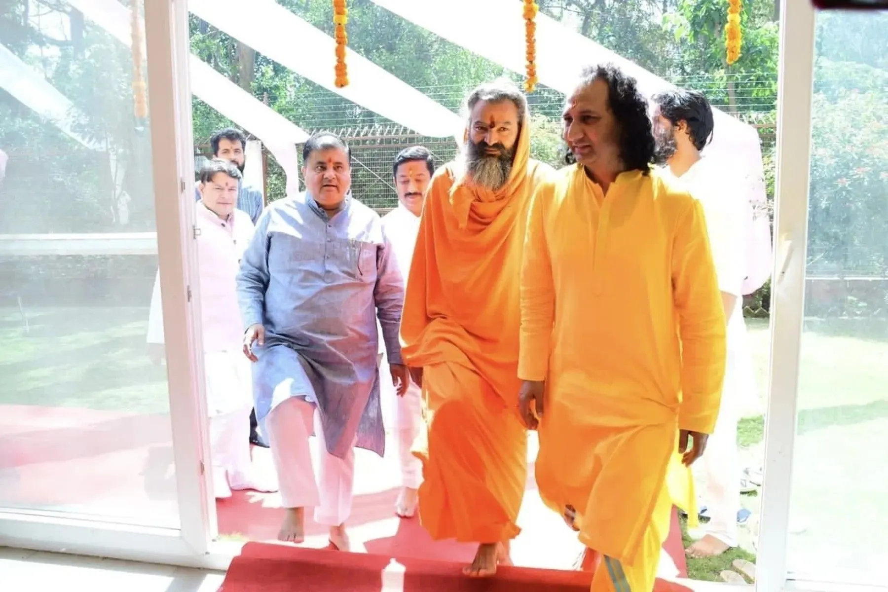 Spiritual leaders and guests entering the wellness center during a ceremonial visit