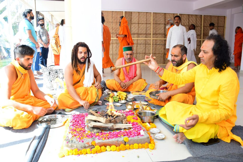 Sacred fire ceremony in Haridwar during a spiritual retreat at Jahnavi Wellness